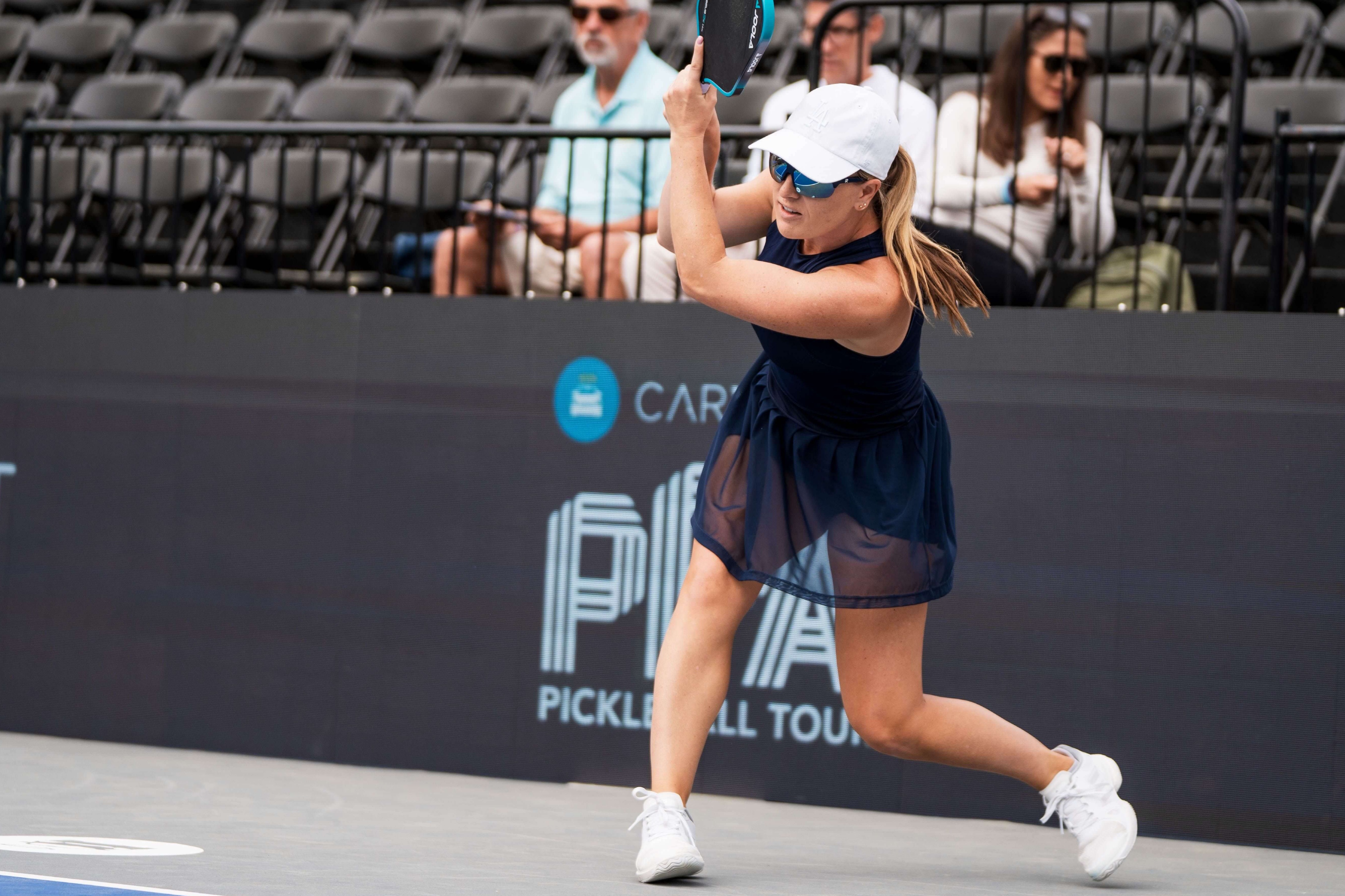Mary Brascia wearing a navy dress